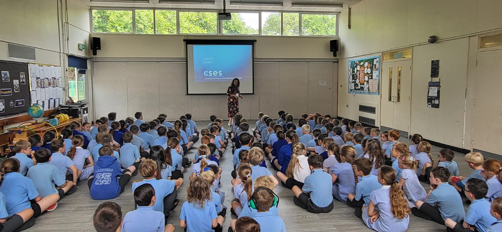 Joanne giving a talk to primary school pupils in their assembly hall
