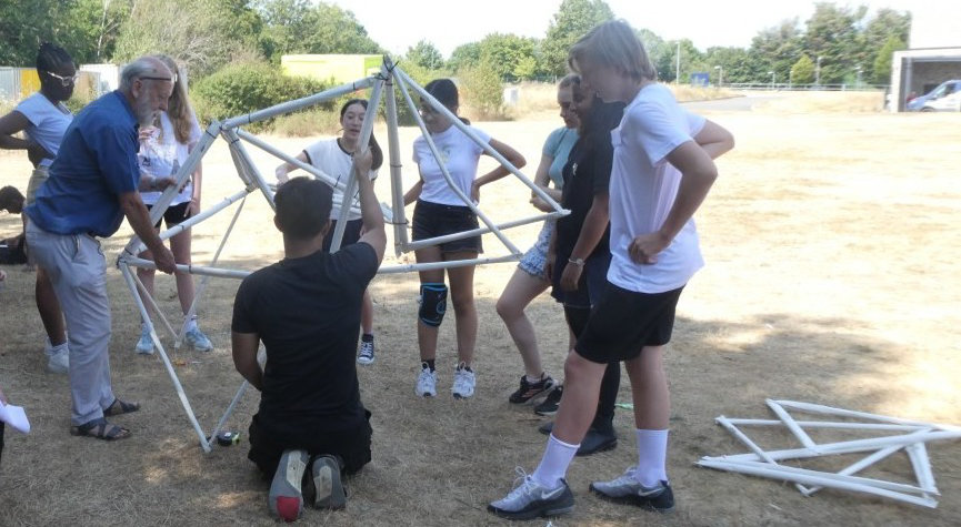 Students building a giant geodesic dome